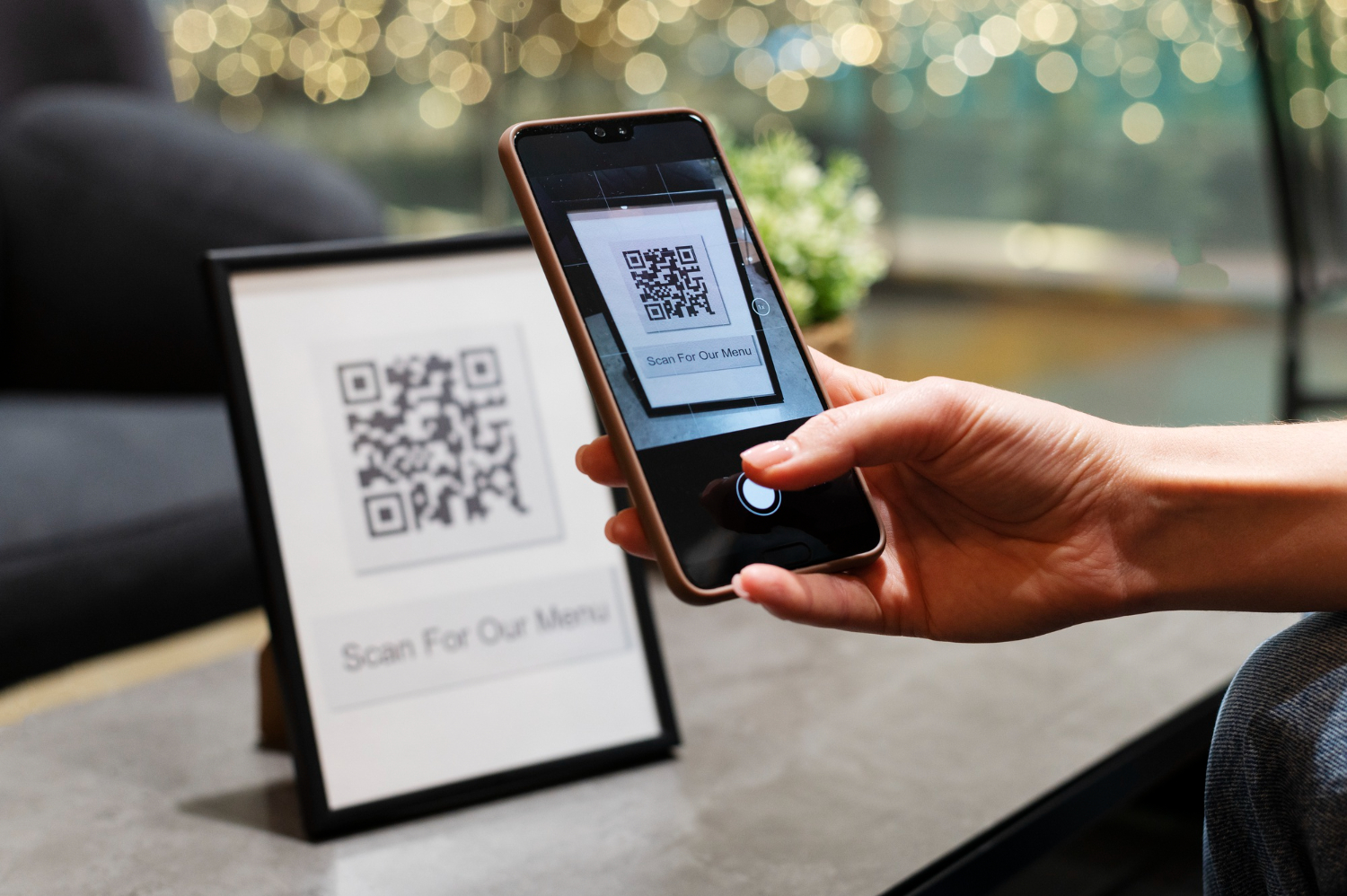 person-scanning-qr-code person-scanning-qr-code